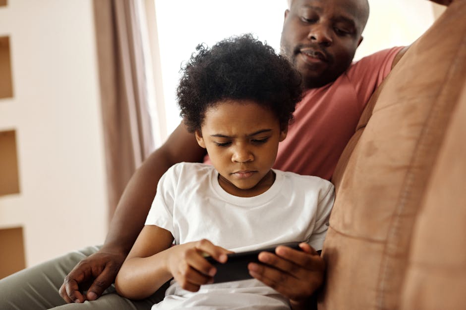 Father and child gaming on phone